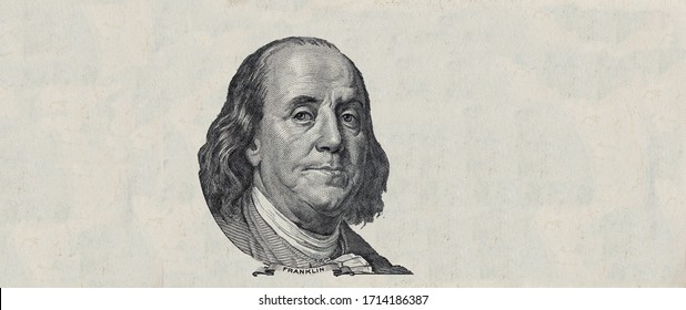 Benjamin Franklin cut on old 100 dollars banknote isolated on white background