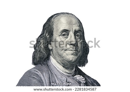 Benjamin Franklin portrait cutting from one hundred dollars bill. Business and finance concept.