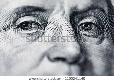 Benjamin Franklin's look on a hundred dollar bill. Benjamin Franklin portrait macro usa dollar banknote or bill