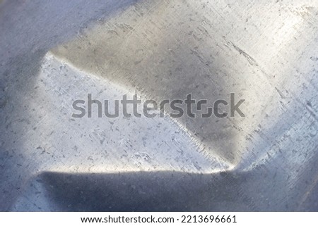 bent metal background with close up