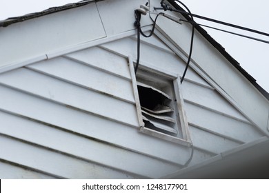 Bent Slats Of Home Attic Vent Showing Signs Of Rodent Entry And Infestation.