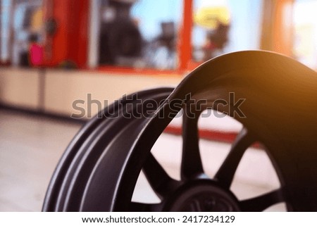 Bent steel rim on a wheel of tires. Damaged steel. Wheel with bent steel rim. Car problems, bad roads, financial expenses