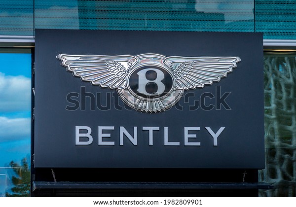 Bentley sign and logo on the car\
showroom in Vilnius, Lithuania on Vilnius, Lithuania on May 30,\
2021. Bentley Motors Limited is a British luxury\
automaker