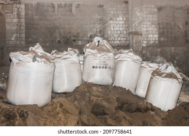 Bentonite Clay Powder Packed In Bags At An Industrial Plant For Processing Sand, Soil And Land.