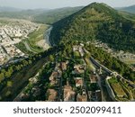 BERAT, ALBANIA, April 13, 2024: Berat castle viewed from boulevard Republika in Albania. High quality photo