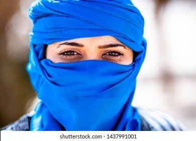 A Berber Women’s With A Dark Eyes And Blues Skarf