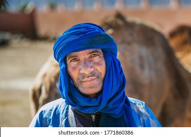 Berber dressed in traditional clothes and turban. Owner of camels at the camel market in Guelmim. Guelmim, Morocco - April 16 2016.