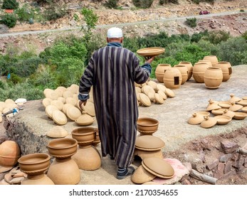 Berber Village, Morocco - March 27, 2022: Berber gentleman selling clay ovens and tagines in his local village.