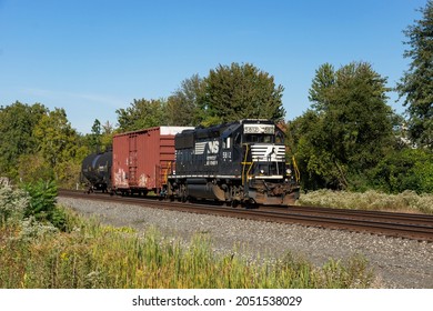 BEREA, OH - October 1, 2021: Originally built in 1980 and then rebuilt in 2005, a 41 year old locomotive powers a small local train on the Norfolk Southern Chicago Line