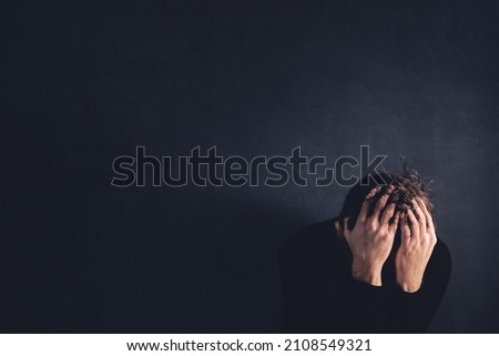 Bereavement concept, sadness and loneliness experienced after loss, adult caucasian male crying