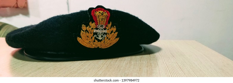 A Beret Cap Of An Indian Coast Guard Officer Resting On A Table