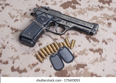 Beretta Hand Gun On  Desert Marines Uniform