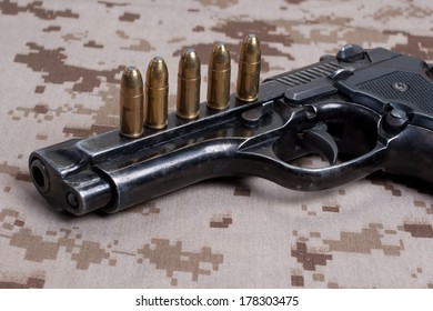 Beretta Hand Gun On  Desert Marines Uniform