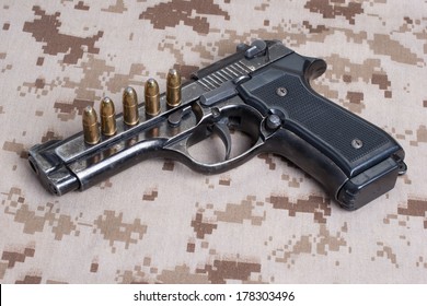 Beretta Hand Gun On  Desert Marines Uniform