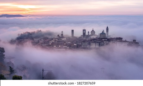 Bergamo Città Alta shrouded in fog on a foggy winter morning, this is the oldest part of medieval Bergamo, Lombardy, Italy.