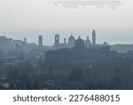 Bergamo, Italy. Amazing aerial landscape of the old town. Humidity and pollution in the air. Fall season. Morning time. Bergamo, one of the most beautiful city in Italy