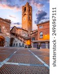 Bergamo, Italy. Campanone Tower in Piazza Vecchia - Citta Alta, morning twilight illuminated, beautiful historical town in Lombardy