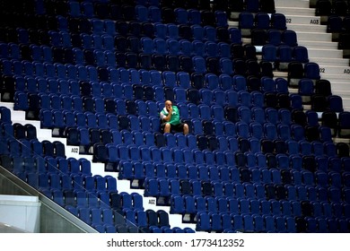 BERGAMO, ITALY - July 8, 2020: 
A steward sits on empty stands as play resumes behind closed doors during the Serie A 2019/2020 ATALANTA v SAMPDORIA at Gewiss Stadium. 