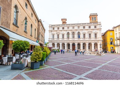 Bergamo, Italy - June 20, 2018: Piazza Vecchia square in the old part of Bergamo with the building of the library in the background