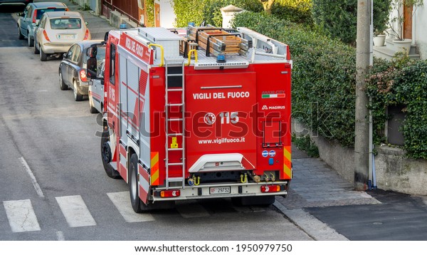 Bergamo, Italy. March 21, 2021. Red fire truck in\
the streets of the city to provide first aid in case of emergency.\
Tank lorry. Street of\
Italy