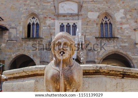 Bergamo, Italy Old Town sphinx fountain. Fontana del Contarini at Piazza Vecchia before Palazzo della Ragione at Citta Alta.