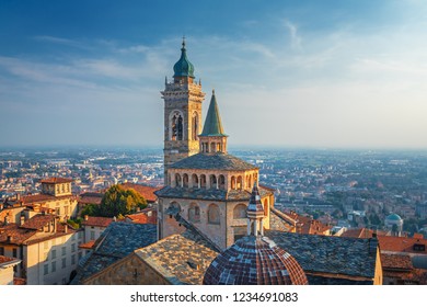 Bergamo, Italy.  Scenic view of the Old city and Basilica of Santa Maria Maggiore and Cappella Colleoni in Citta Alta. Landscape of the city center and the historical buildings during the sunset