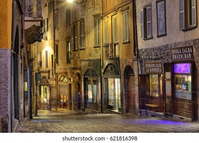 Bergamo Italy, A view of an open bar in Bergamo Citta alta at midnight. 
11.04.2017 Bergamo Italy