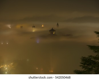 Bergamo - Old city (CittË? Alta). One of the beautiful city in Italy. Lombardia. The fog rises from the plains and wrap all the old city by creating lighting effects.