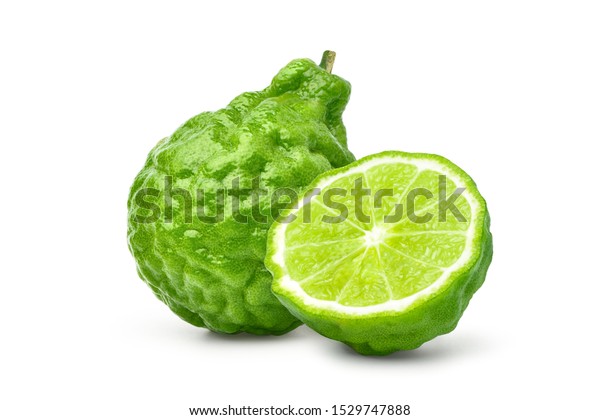 Bergamot fruit with cut in half isolated on white\
background. Clipping\
path.