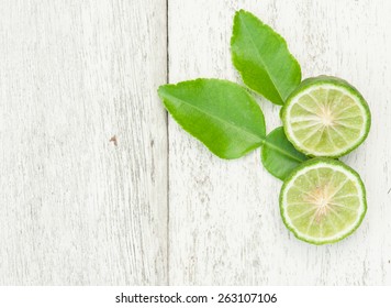 Bergamot Fruit With Green Leafs On White Wood Background