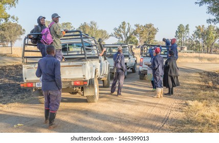 Bergville, South Africa - July 16, 2019: Unidentified Black Farm Workers Are Dropped Off At Roadside At The End Of A Work Day Image In Landscape Format