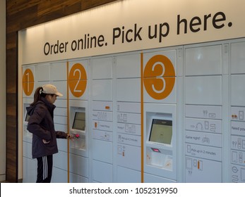 BERKELEY, CA - MARCH 17, 2018: A woman picks up her package from Amazon Locker inside the Amazon Store at the University of California, Berkeley's student union.