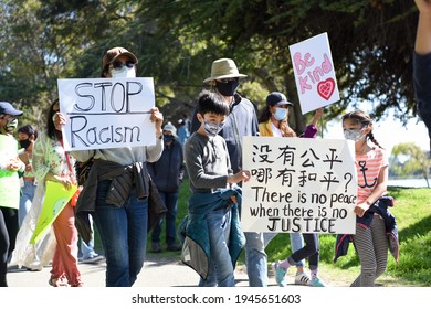 Berkeley, CA USA - March 28 2021: Youth Organizers Draw Hundreds Of Protestors For A Stop Asian Hate Rally At Berkeley’s Aquatic Park To Speak Out Against AAPI Violence And Ending Racism.