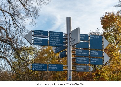 Berlin 2021: Signposts On The Campus Of Freie Universität Berlin To Various Faculties, The Enrollment Office, And The Student Advisory Service.