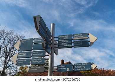 Berlin 2021: Signposts On The Campus Of Freie Universität Berlin To Various Faculties, The Enrollment Office, And The Student Advisory Service.