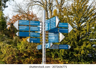 Berlin 2021: Signposts On The Campus Of Freie Universität Berlin To Various Faculties, The Enrollment Office, And The Student Advisory Service.