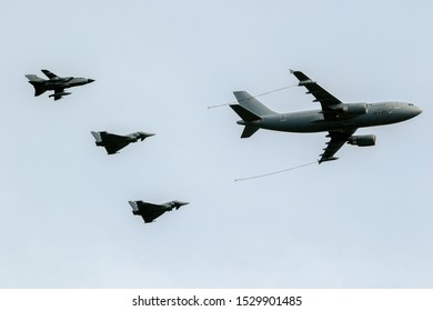 BERLIN - APR 27, 2018: German Air Force Airbus A310 MRTT Plane Aerial Refuelling Two Eurofighter Typhoons Fighter Jets And Tornado Fighter Bombers During The Berlin ILA Air Show.