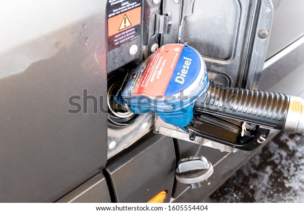 Berlin, Berlin/Germany -\
12.07.2019: A diesel fuel gun in a vehicle transporter while\
refueling