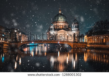 Berlin Cathedral (Berliner Dom) on Spree river snowing in winter time