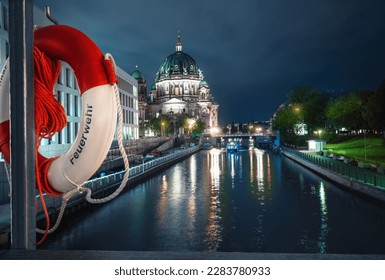 Berlin Cathedral at night and lifebuoy at Rathaus Bridge - Berlin, Germany - Powered by Shutterstock