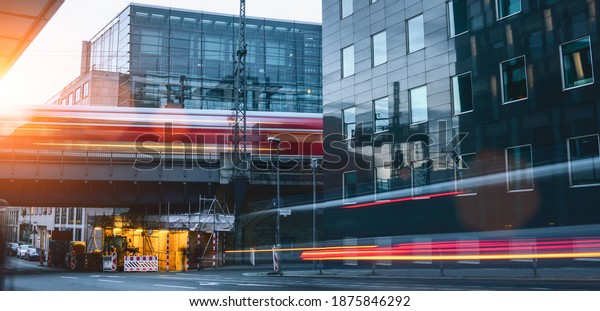 berlin city traffic rush in office\
district. cars and train motion blur long exposure\
shot