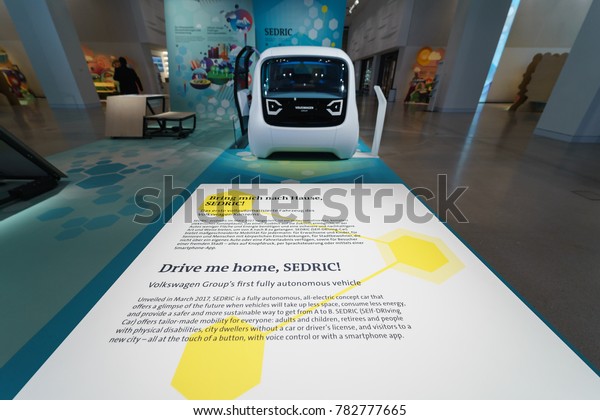 BERLIN - DECEMBER 21, 2017: Showroom.\
Presentation of a new concept car without a driver (Self Driving\
Car) Volkswagen Sedric.