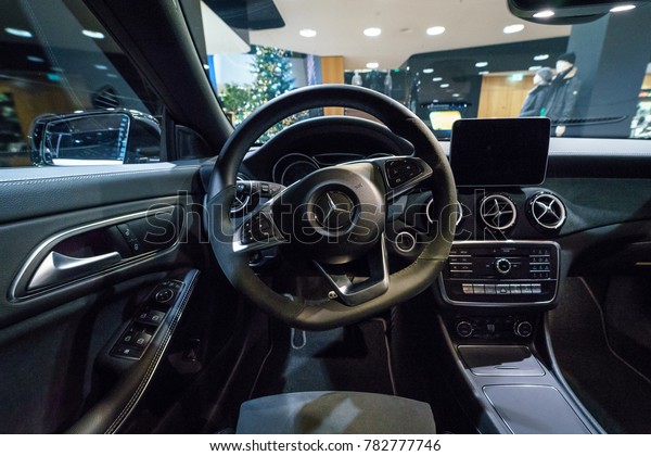 BERLIN - DECEMBER 21, 2017: Showroom. Interior of\
subcompact executive car Mercedes-Benz CLA-Class CLA 220d Peak\
Edition. Since 2014.