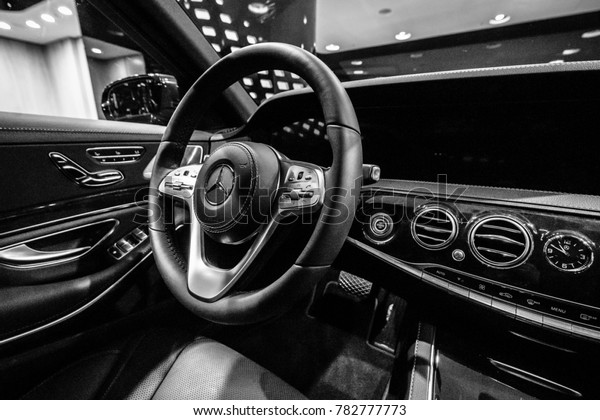 BERLIN - DECEMBER 21, 2017: Showroom. Interior of\
the full-size luxury car Mercedes-Benz S-Class S350d (W222\
Facelift). Black and white. Since\
2017.