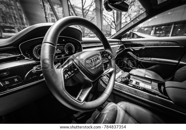 BERLIN - DECEMBER 21, 2017: Showroom. Interior of\
the full-size luxury car Audi A8 3.0 TDI quattro (286PS). Since\
2018. Black and white.