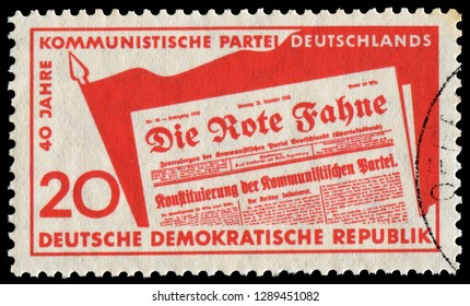 Berlin, East Germany - Dec. 30, 1958: Forty Years Of Communist Newspaper “The Red Flag”and German Communist Party. Stamp Issued By East Germany In 1958.