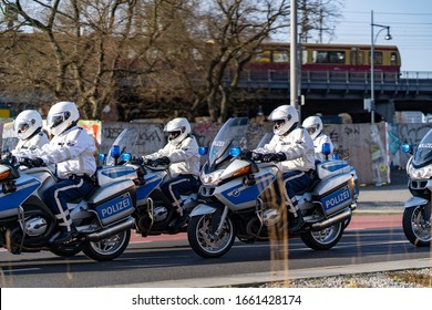 Berlin, Germany, 01.032020: a group of police motorcyclists accompanied by government officials, police officers on motorcycles
