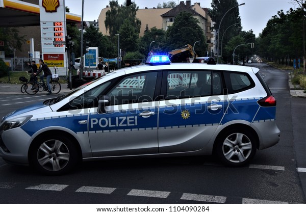 Berlin, Germany 03.06.2018 police car is standing\
on the signal