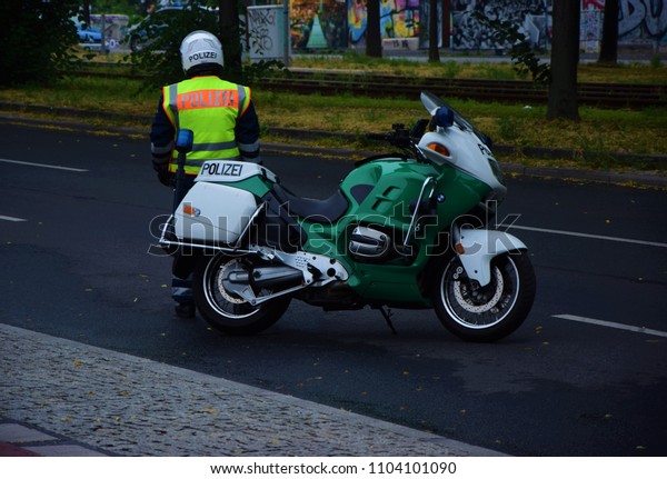Berlin, Germany 03.06.2018 policeman with a\
police motorcycle