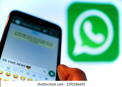 Berlin, Germany - 11 25 2020 Macro close up of a thumb finger on mobile smartphone screen texting. Corona virus fake news in Whats App account. Whats App changes to curb spread of misinformation.